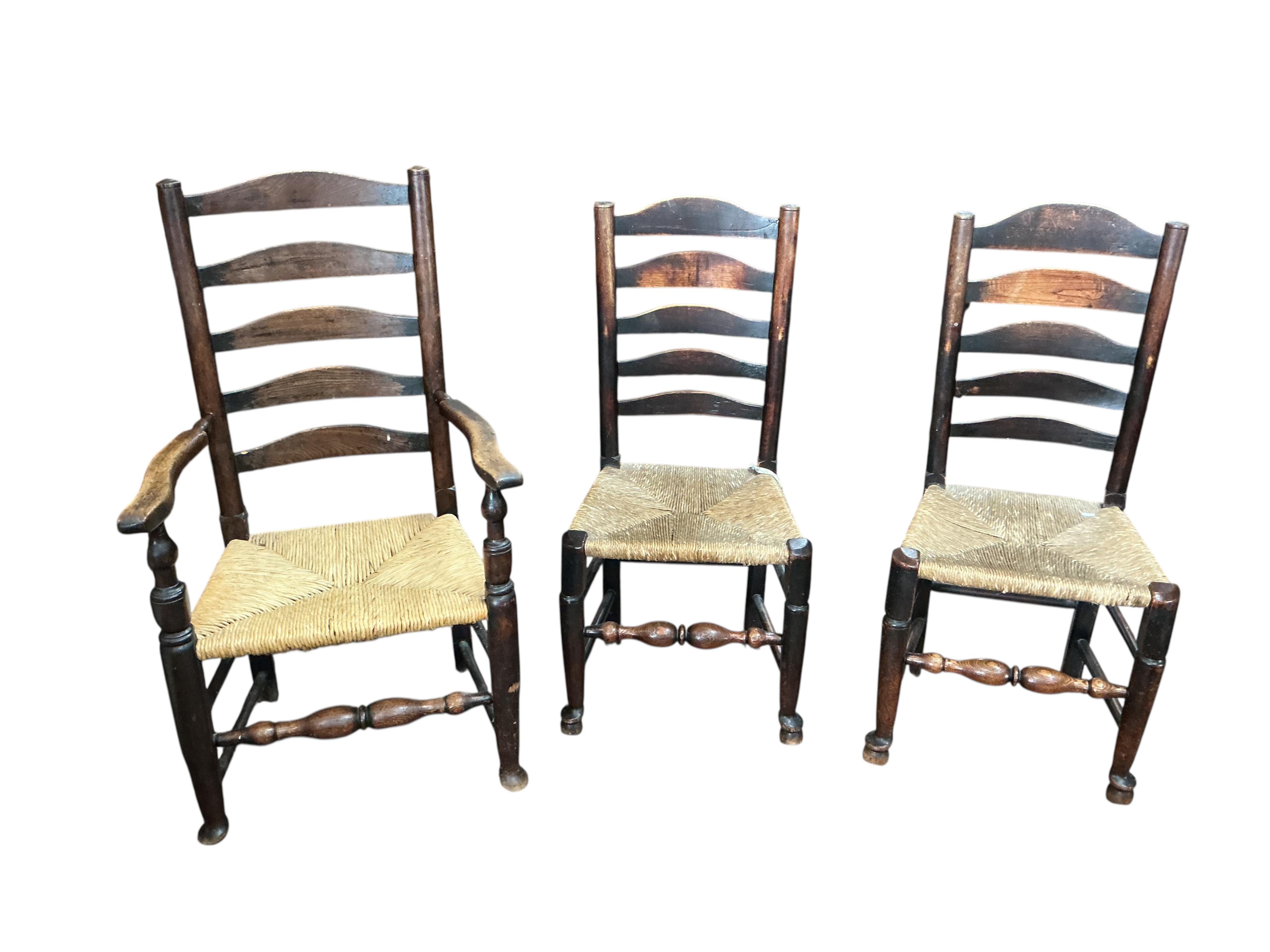 A harlequin set of six 19th century Provincial ladderback dining chairs, one with arms